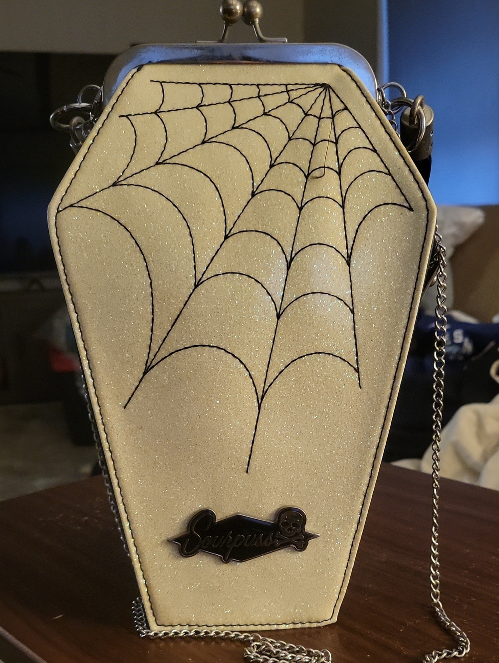Sourpuss Sparkling Cream Coffin Crossbody with Black Spiderweb